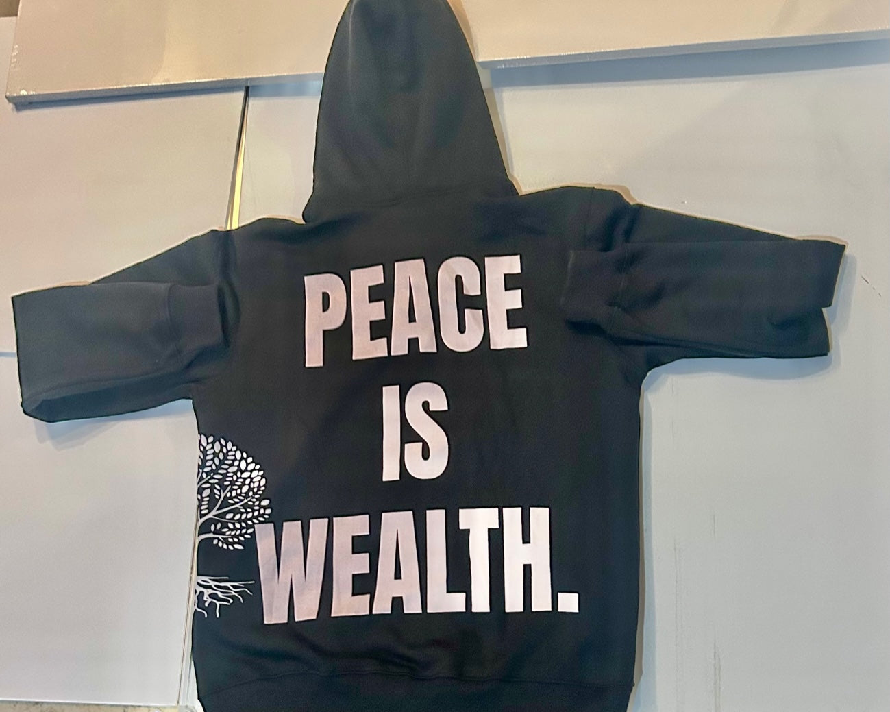 Peace is Wealth zip-up hoodie